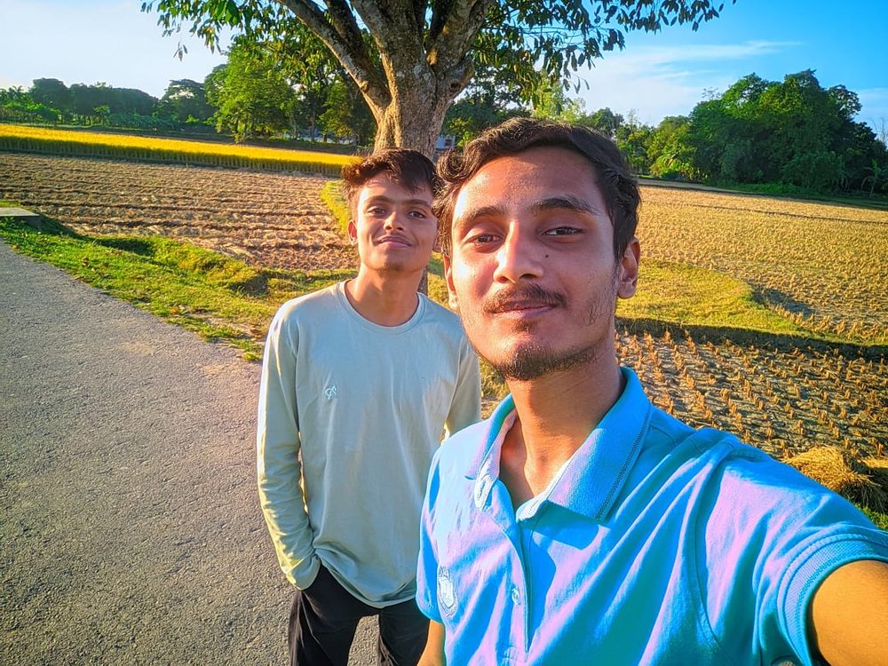 Zihadul Islam with Saiem, outdoors in Kishoreganj